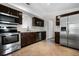Traditional Kitchen featuring stainless steel appliances, and tile floors at 5671 Sycamore Canyon Dr, Kissimmee, FL 34758