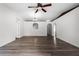 Spacious living room featuring hardwood floors, recessed lighting and white paint at 5671 Sycamore Canyon Dr, Kissimmee, FL 34758