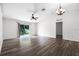 Bright living room with hardwood floors and sliding glass doors to the backyard at 5671 Sycamore Canyon Dr, Kissimmee, FL 34758
