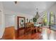 Dining room with hardwood floors, chandelier, and full-length mirror at 6631 Crenshaw Dr, Orlando, FL 32835