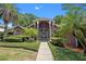 Gorgeous home featuring lush landscaping and an elegant gated entryway and walkway at 6631 Crenshaw Dr, Orlando, FL 32835