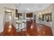 Open kitchen with stainless steel appliances, granite countertops, and hardwood floors at 6631 Crenshaw Dr, Orlando, FL 32835