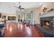 Inviting living room featuring a fireplace, hardwood floors, and natural light at 6631 Crenshaw Dr, Orlando, FL 32835