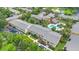 Aerial view of condo complex with swimming pool, landscaping, and ample parking at 754 E Michigan St # 182, Orlando, FL 32806