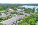 Aerial view of an apartment complex featuring a pool and lush greenery at 754 E Michigan St # 182, Orlando, FL 32806