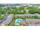 Overhead shot of the community pool, nearby apartments, and beautiful landscaping at 754 E Michigan St # 182, Orlando, FL 32806