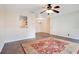 Inviting living room featuring a ceiling fan and a decorative red rug at 754 E Michigan St # 182, Orlando, FL 32806