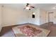 Open living room featuring a ceiling fan and a decorative red rug at 754 E Michigan St # 182, Orlando, FL 32806