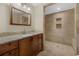 Bathroom featuring tile shower, niche, and vanity with sink at 7838 Sloewood Dr, Mount Dora, FL 32757