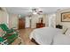 Bright primary bedroom features tile floors and ample space for relaxation and television viewing at 7838 Sloewood Dr, Mount Dora, FL 32757