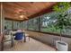 Relaxing screened porch with wood ceiling and nature views at 7838 Sloewood Dr, Mount Dora, FL 32757