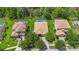 Aerial view of a home featuring a private, screened-in pool and backyard in a serene, wooded neighborhood at 9110 Stromboli Ct, Kissimmee, FL 34747