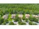 Aerial view of the neighborhood featuring homes with well-maintained yards and partial tree coverage at 9110 Stromboli Ct, Kissimmee, FL 34747