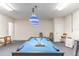 Garage with a pool table, foosball table, and ample open space at 9110 Stromboli Ct, Kissimmee, FL 34747