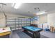 Garage featuring a pool table, air hockey table, and a washer and dryer at 9110 Stromboli Ct, Kissimmee, FL 34747