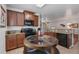 Kitchen featuring granite countertops, breakfast bar, stainless steel appliances, and wood cabinets at 9110 Stromboli Ct, Kissimmee, FL 34747