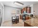 Kitchen featuring granite countertops, stainless steel appliances, and a cozy breakfast table at 9110 Stromboli Ct, Kissimmee, FL 34747