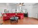 Open concept living room seamlessly connecting to the dining area, enhancing social gatherings and conversations at 9110 Stromboli Ct, Kissimmee, FL 34747