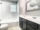 Bathroom featuring tub and shower with a gray vanity and a white countertop at 1030 Bending Oak Trl, Winter Garden, FL 34787