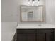 Bathroom with neutral walls and a large mirror at 1030 Bending Oak Trl, Winter Garden, FL 34787