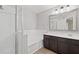 Bathroom featuring a shower and bathtub with dark wood vanity at 1030 Bending Oak Trl, Winter Garden, FL 34787