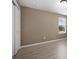 A simple bedroom with light colored wood-look floors and a closet for storage at 1030 Bending Oak Trl, Winter Garden, FL 34787