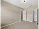 Bedroom with neutral walls, carpeted floors, and a closet for ample storage at 1030 Bending Oak Trl, Winter Garden, FL 34787