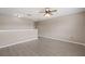 Large bonus room with wood-style floors and neutral walls at 1030 Bending Oak Trl, Winter Garden, FL 34787