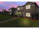 Charming home featuring well-manicured lawn, landscaping, and classic architectural details under a colorful sunset at 1030 Bending Oak Trl, Winter Garden, FL 34787