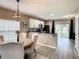 Kitchen with stainless steel appliances, black countertops, and island at 1030 Bending Oak Trl, Winter Garden, FL 34787