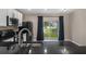 Eat-in kitchen with black appliances, granite countertops, and sliding glass door at 1030 Bending Oak Trl, Winter Garden, FL 34787