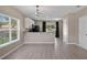 Modern kitchenette featuring white cabinets and a window with natural light at 1030 Bending Oak Trl, Winter Garden, FL 34787