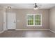 Bright and airy living room with a large window and neutral wall color at 1030 Bending Oak Trl, Winter Garden, FL 34787