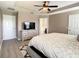 Main bedroom with ceiling fan and bath ensuite at 1030 Bending Oak Trl, Winter Garden, FL 34787