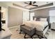 Comfortable main bedroom with a tray ceiling, soft lighting, and a cozy bed at 1030 Bending Oak Trl, Winter Garden, FL 34787