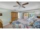 Inviting bedroom featuring a sliding glass door to the private outdoor seating area at 104 Autumn Dr, Longwood, FL 32779