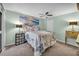 Light and airy bedroom featuring coastal wall art and a ceiling fan at 104 Autumn Dr, Longwood, FL 32779