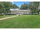 Beautifully maintained community clubhouse with manicured lawn and mature trees at 104 Autumn Dr, Longwood, FL 32779