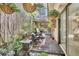 Cozy courtyard filled with lush plants, hanging baskets, and comfortable seating for outdoor relaxation at 104 Autumn Dr, Longwood, FL 32779