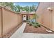 Charming front courtyard with blue Adirondack chairs and a well-manicured garden at 104 Autumn Dr, Longwood, FL 32779