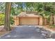 Spacious two-car garage with a neutral door and ample driveway space at 104 Autumn Dr, Longwood, FL 32779