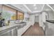 Charming kitchen featuring sleek countertops, modern appliances, and a sunlit window with garden view at 104 Autumn Dr, Longwood, FL 32779