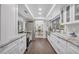Bright, modern kitchen with white cabinetry, stainless steel appliances, and granite countertops, open to the dining area at 104 Autumn Dr, Longwood, FL 32779