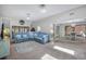 Spacious living room with a large sectional sofa, access to the backyard, and an open dining area, ideal for gatherings at 104 Autumn Dr, Longwood, FL 32779