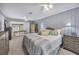 Spacious main bedroom featuring plush carpeting, neutral tones, and a sliding door with outdoor access at 104 Autumn Dr, Longwood, FL 32779