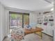 A versatile bonus room with a massage table and shelving for storage and organization at 104 Autumn Dr, Longwood, FL 32779
