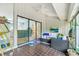 Relaxing sunroom with tiled floors and comfortable furniture, perfect for enjoying natural light and views at 104 Autumn Dr, Longwood, FL 32779