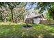 Serene backyard featuring mature trees providing ample shade and a newly installed wooden fence at 1121 Northern Way, Winter Springs, FL 32708