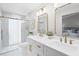 Bathroom features double sinks, white cabinets, glass shower and gold hardware at 1121 Northern Way, Winter Springs, FL 32708