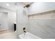 Modern bathroom featuring a soaking tub, rain shower, and stylish tile at 1121 Northern Way, Winter Springs, FL 32708
